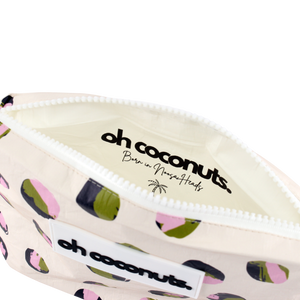 born in noosa heads inside pink, green and navy oh coconuts pouch. 