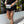 model wearing black and white bumbag around pool