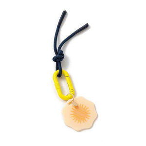 bright yellow and navy blue keychain with sun design