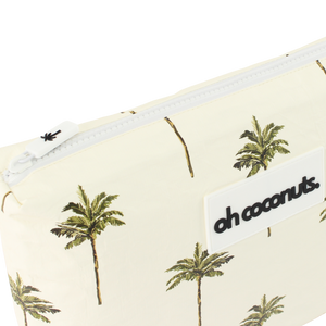 wet dry bag with palm trees on a beige background with palm tree zip