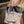 coco beach bag slid over a carry on suitcase 