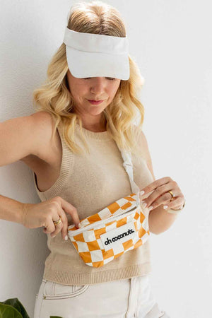 Model with mustard and white bumbag by oh coconuts