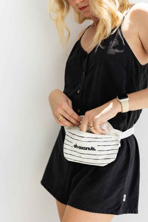 black and white bumbag on model with adjustable strap