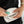 black and white bumbag on model with born in noosa heads on the inside