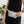 Black and white bumbag on model in black dress