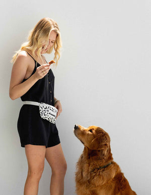 black and white bumbag on model with retriever dog