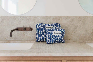 large and medium navy blue oh coconuts in modern beige bathroom