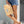model holding mustard and white checkered wet dry bag