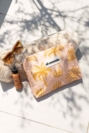 flat lay sunglasses towel and wet dry bag 