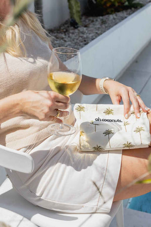 model holding wine and palm tree wet dry bag 