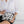 model holding white and black palm tree pouch