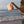 model on beach holding pink oh coconuts palm tree print bag