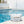 water spilling over blue and white checkered bag by pool
